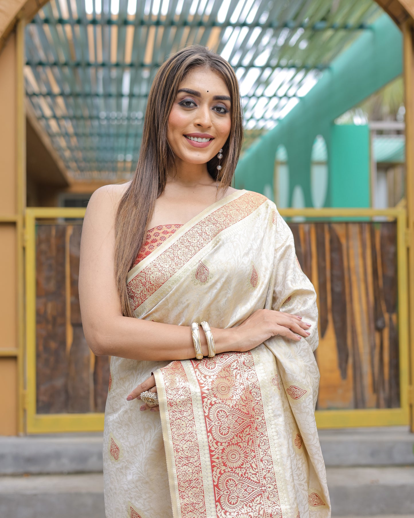 Heavy Embroidered Off-White saree with Red Zari Border paired with Blouse