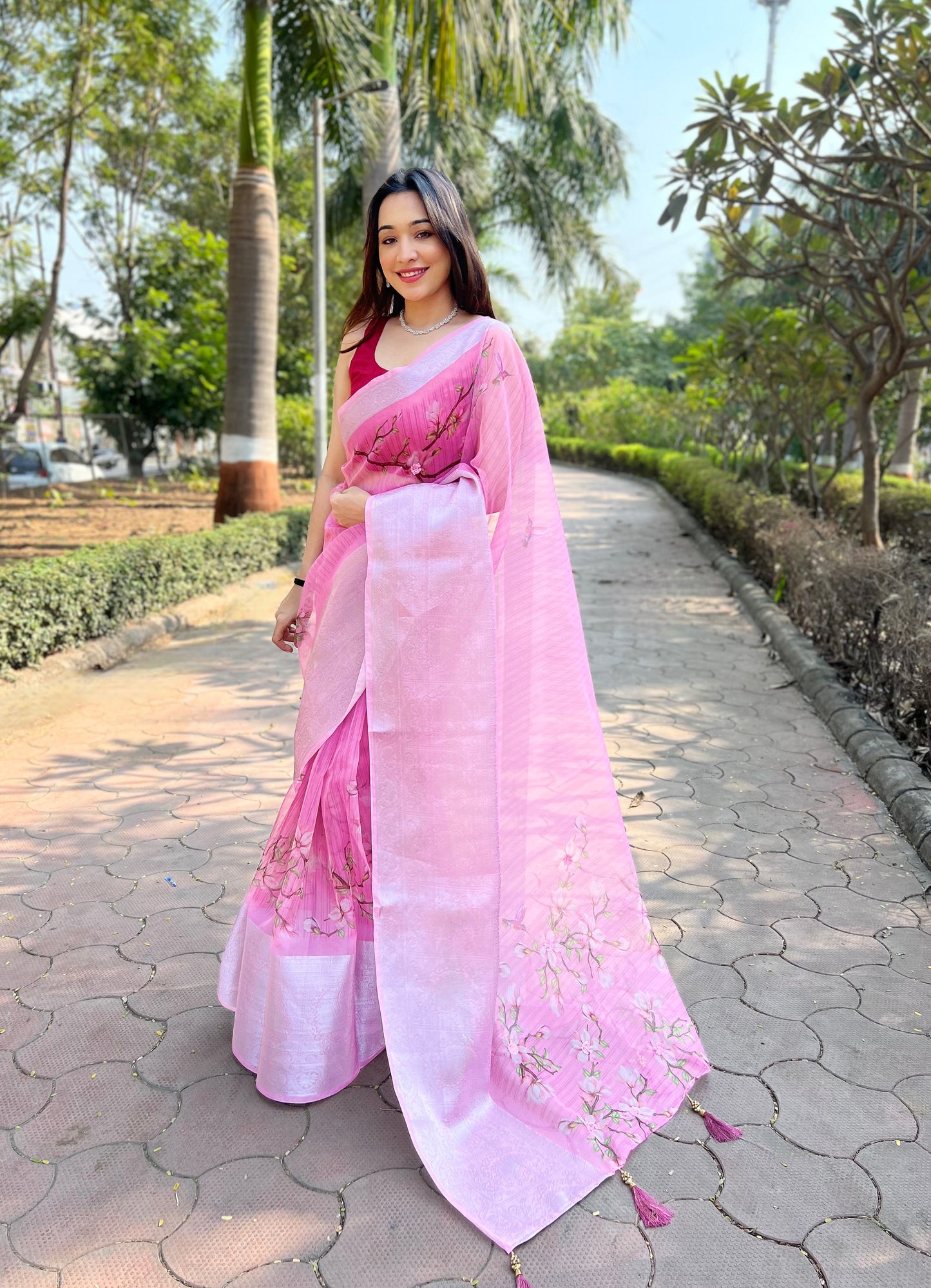 Hand-Woven Soft-Peach Pure Organza Silk Saree featuring a Pure Zari Border, Hand-Painted Designs above the Border, and Delicate Pearl Tassels with Blouse