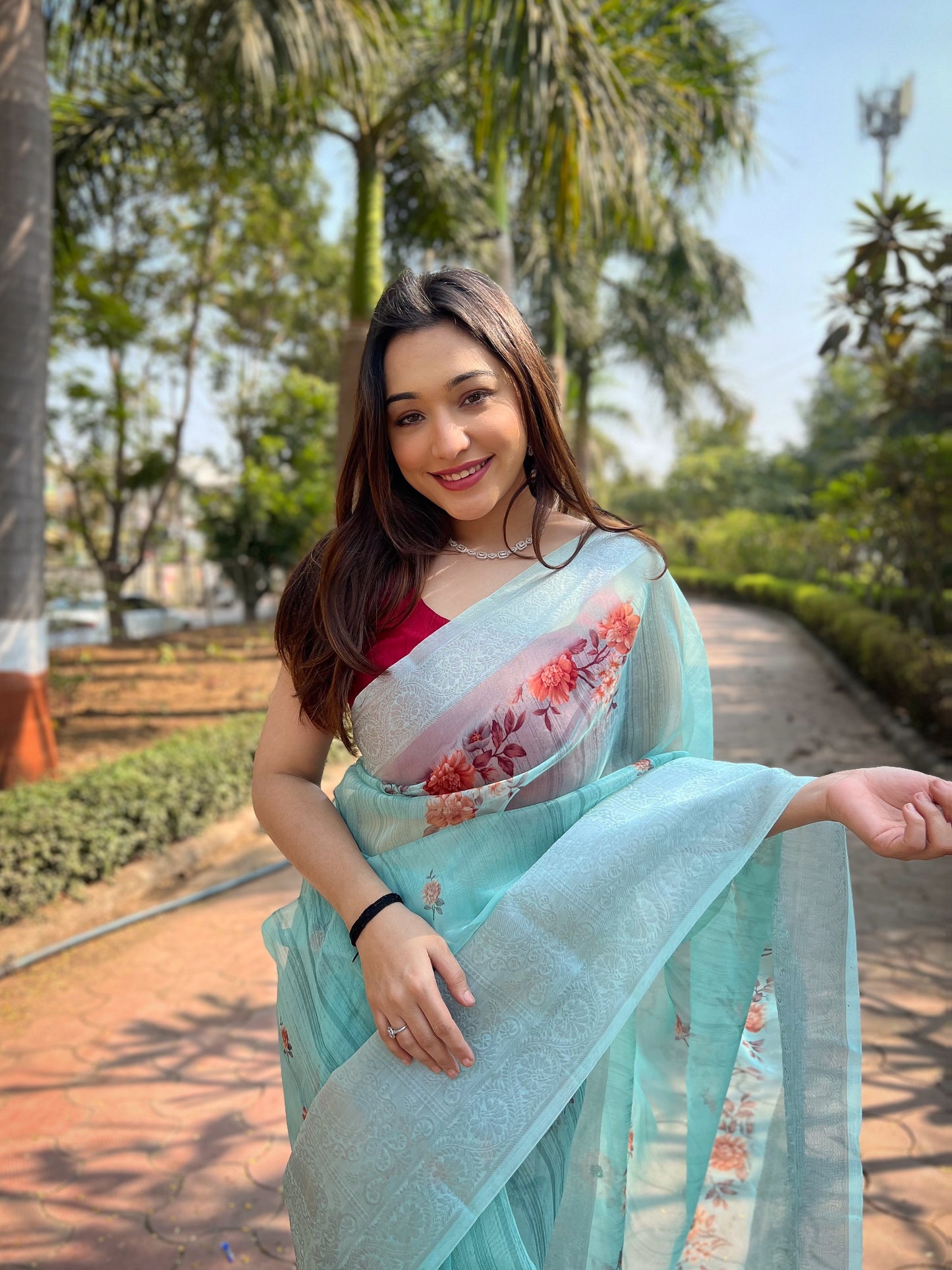 Hand-Woven Sea-Green Pure Organza Silk Saree featuring a Pure Zari Border, Hand-Painted Designs above the Border, and Delicate Pearl Tassels with Blouse