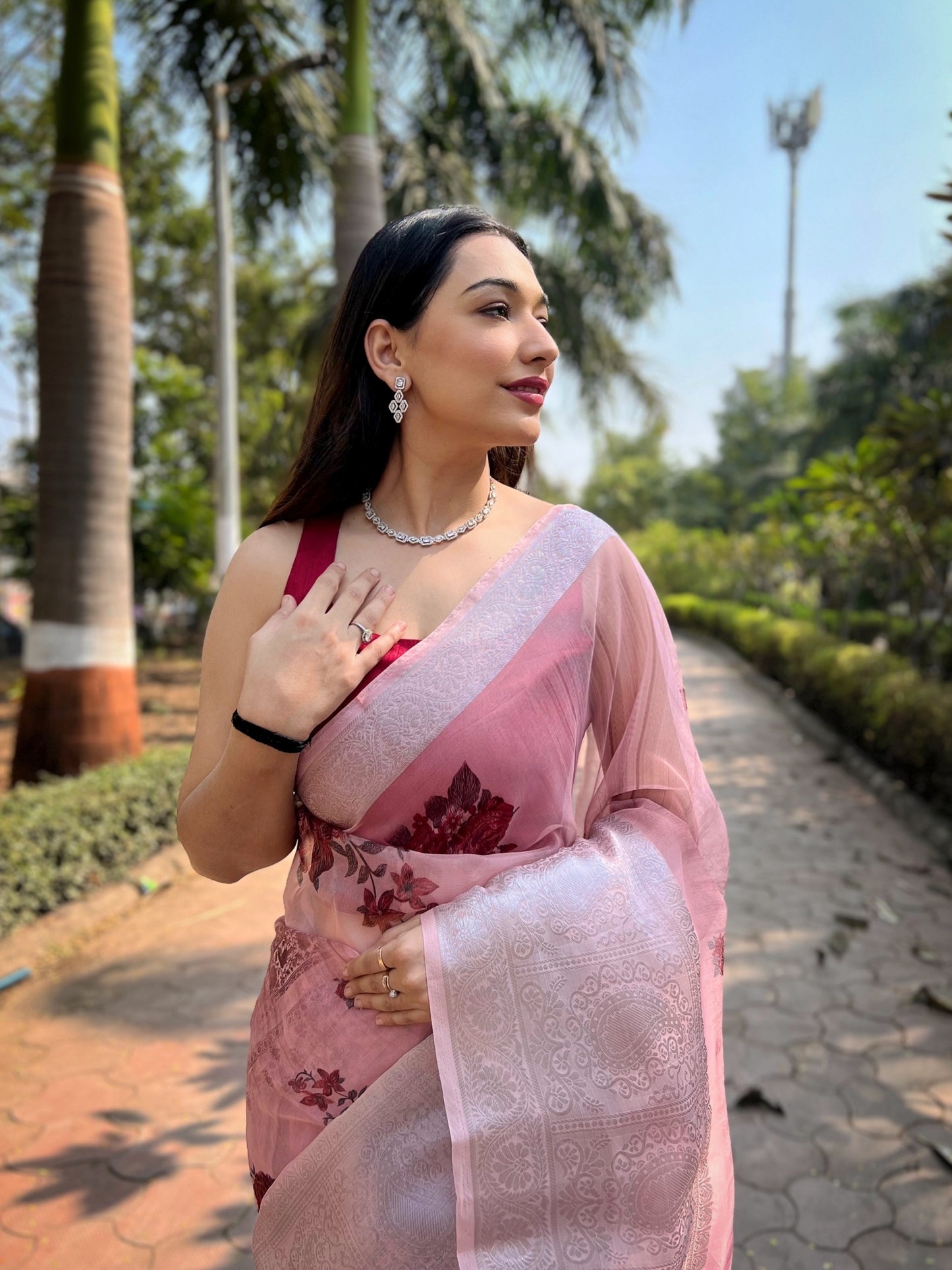 Hand-Woven Baby-Pink Pure Organza Silk Saree featuring a Pure Zari Border, Hand-Painted Designs above the Border, and Delicate Pearl Tassels with Blouse