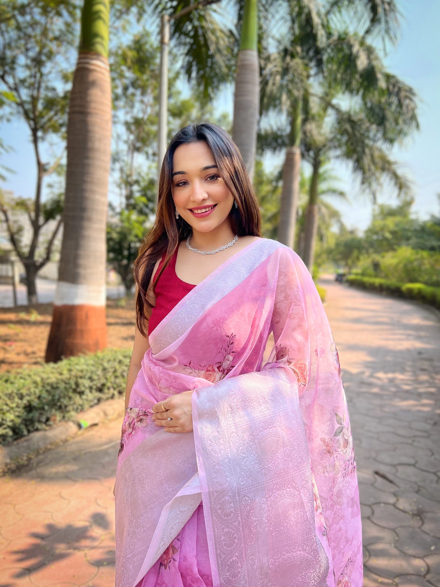 Hand-Woven Fresh-Pink Pure Organza Silk Saree featuring a Pure Zari Border, Hand-Painted Designs above the Border, and Delicate Pearl Tassels with Blouse