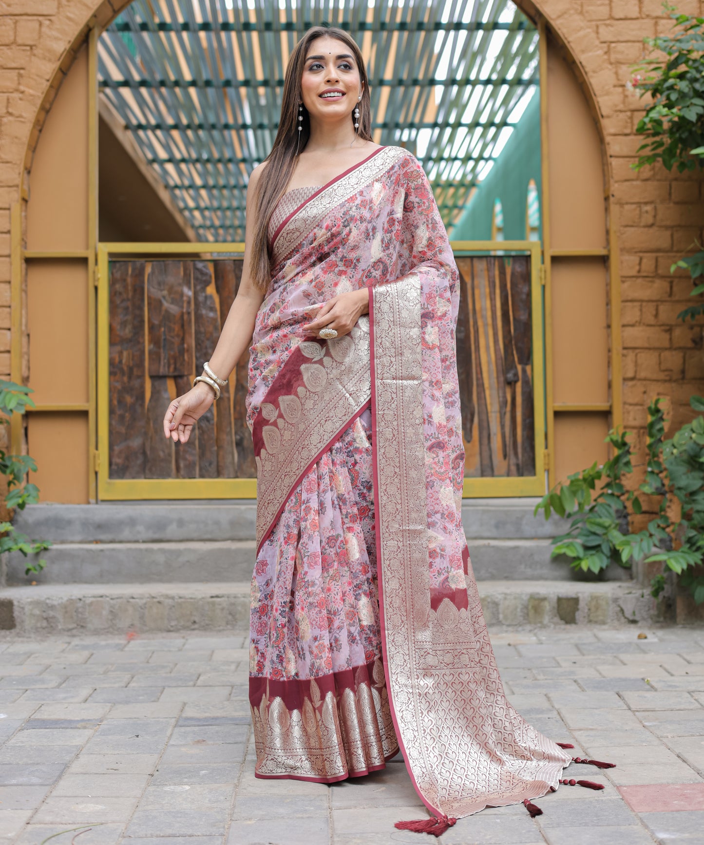 Pure Georgette Salmon-Pink saree in Digital-Print with Maroon Heavy Zari Border and Tassels paired with Blouse