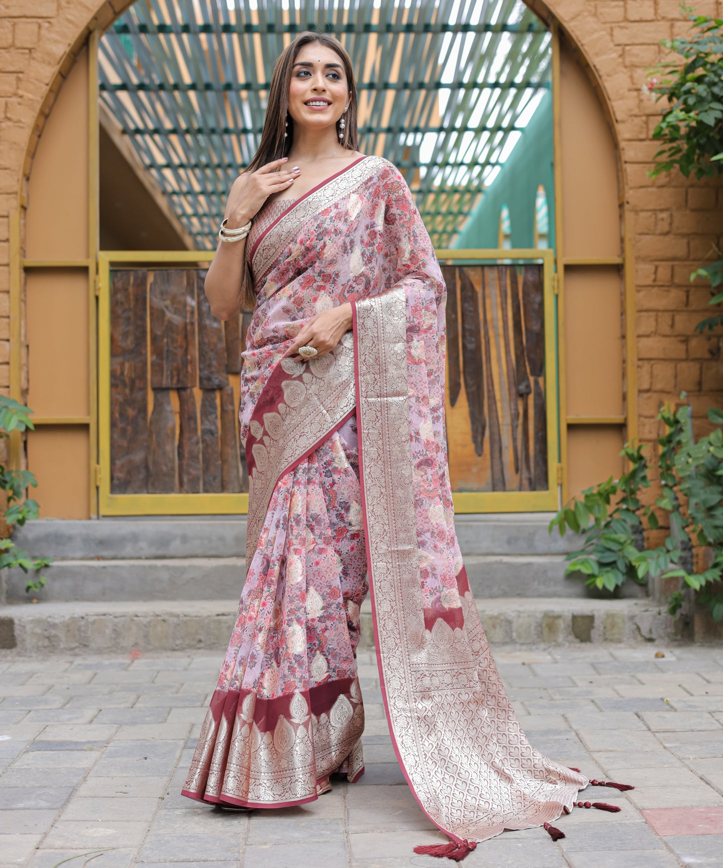 Pure Georgette Salmon-Pink saree in Digital-Print with Maroon Heavy Zari Border and Tassels paired with Blouse