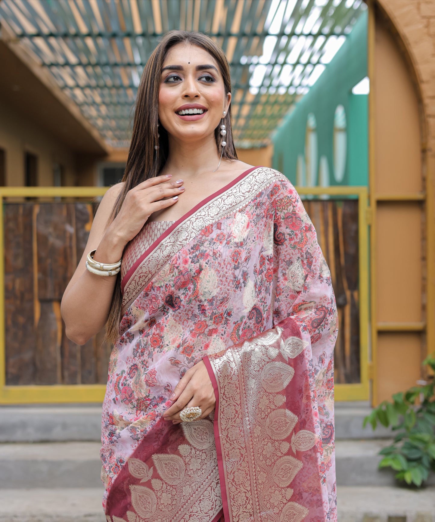 Pure Georgette Salmon-Pink saree in Digital-Print with Maroon Heavy Zari Border and Tassels paired with Blouse