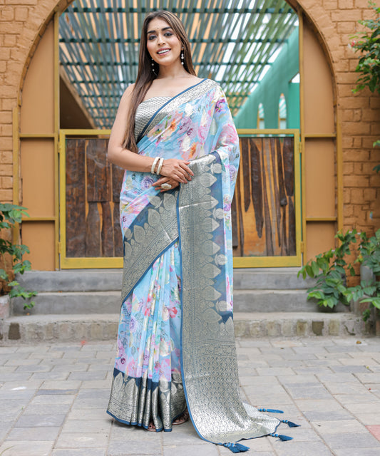 Pure Georgette Powder-Blue saree in Digital-Print with Dark-Blue Heavy Zari Border and Tassels paired with Blouse