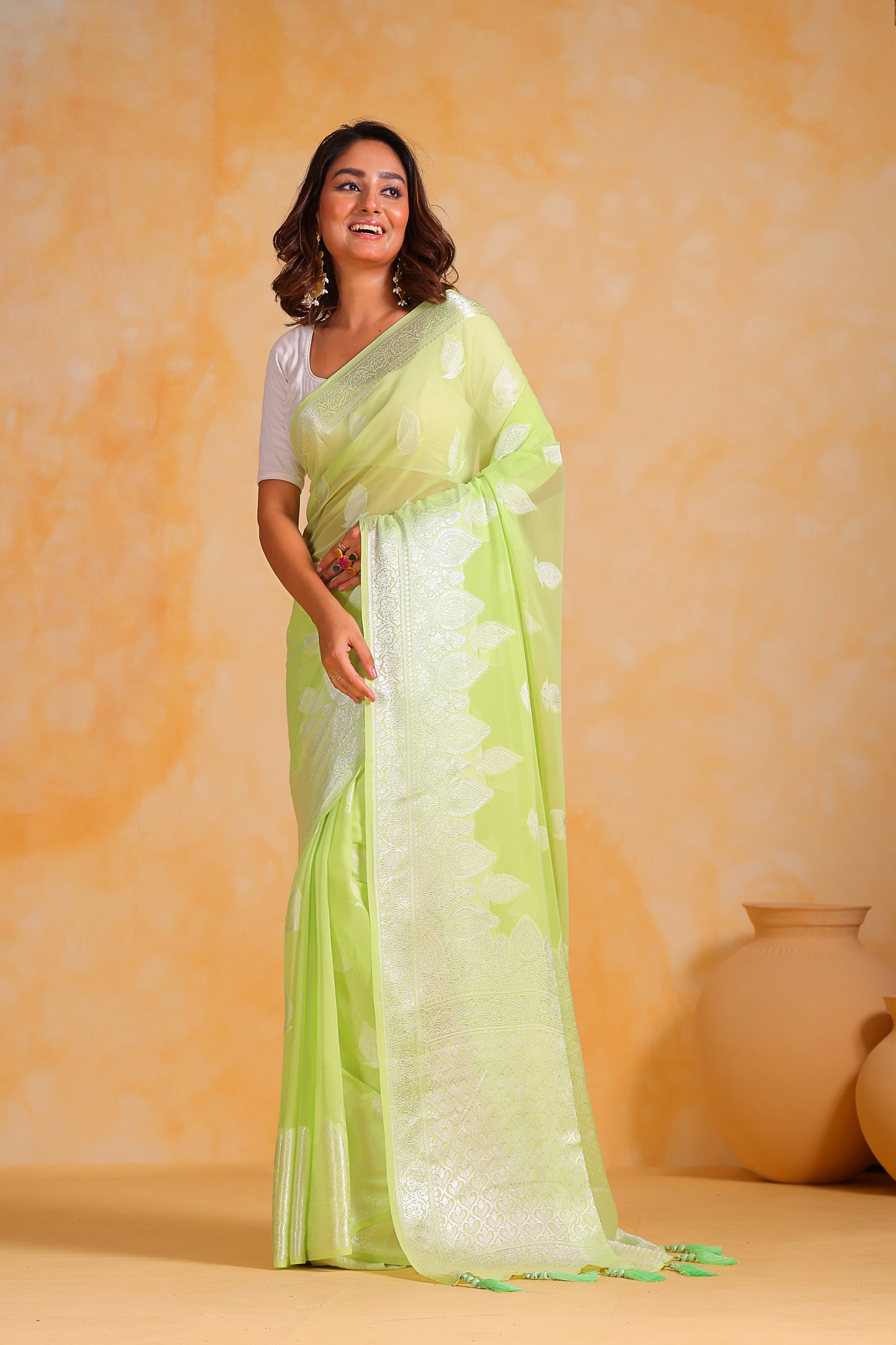 Hand-Woven Mint-Green Pure Georgette-Silk Saree with Tassels and Heavy Blouse
