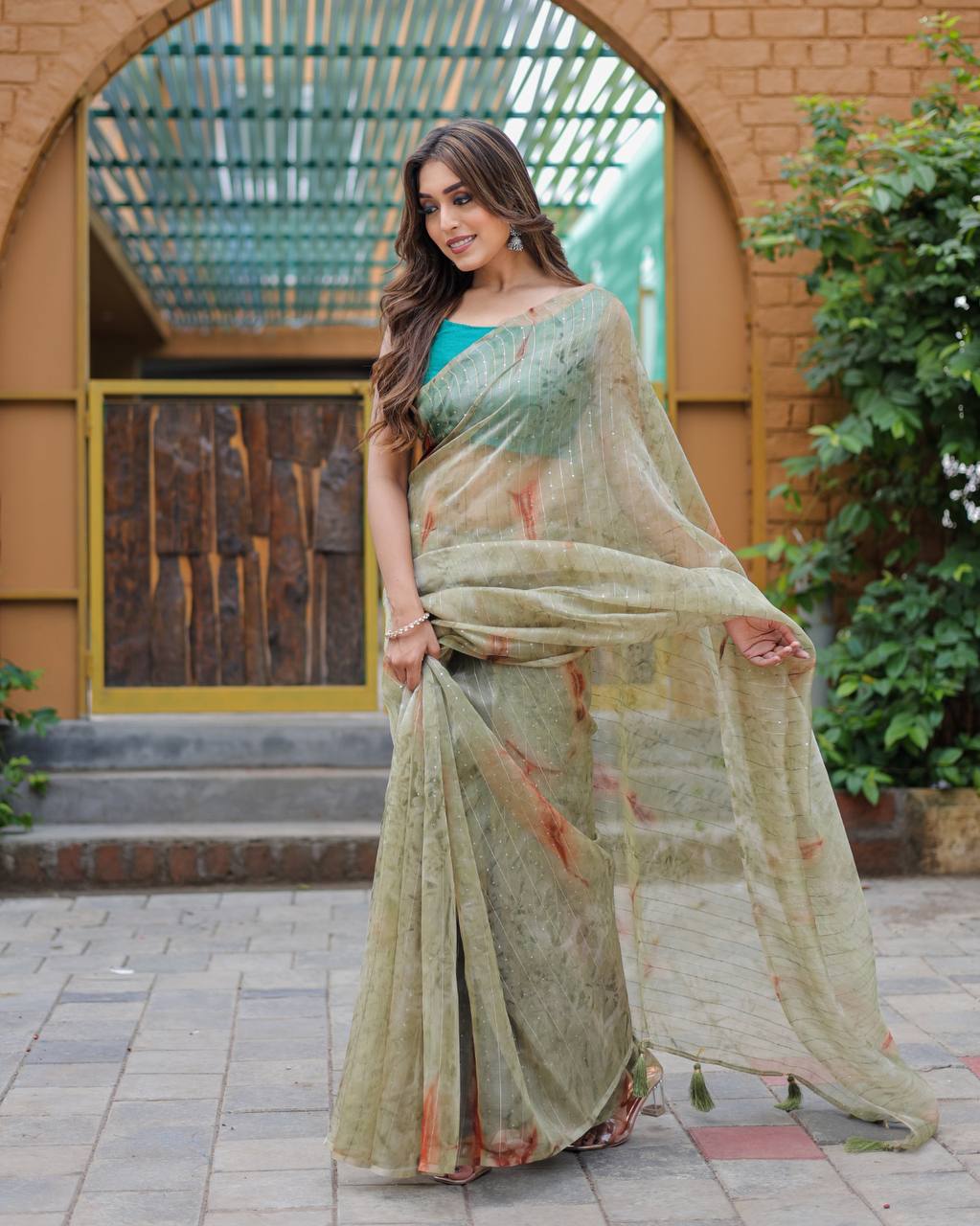 Mehendi-Green Pure Organza-Silk saree with all over Zari Sequins and Tassels paired with Blouse