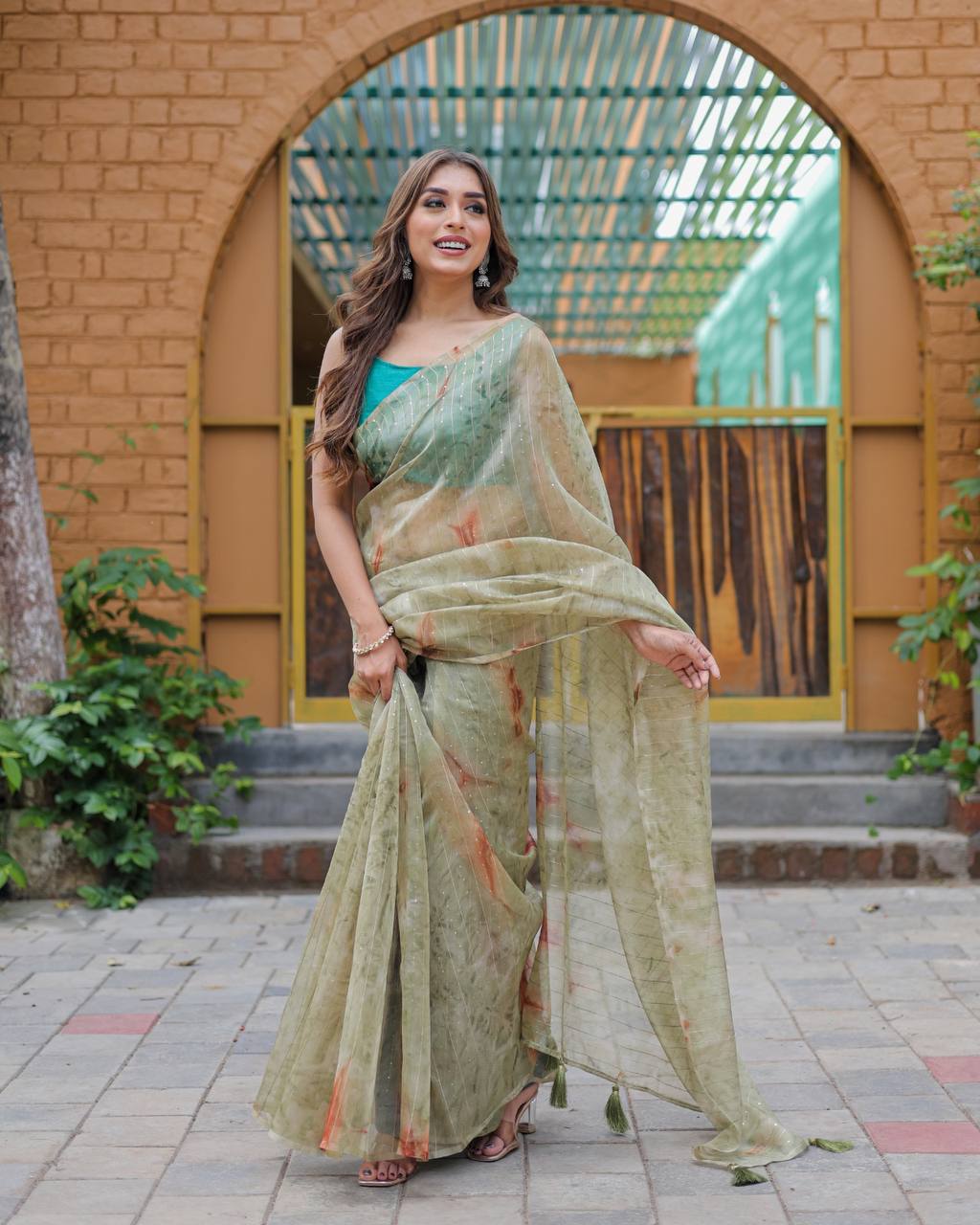 Mehendi-Green Pure Organza-Silk saree with all over Zari Sequins and Tassels paired with Blouse