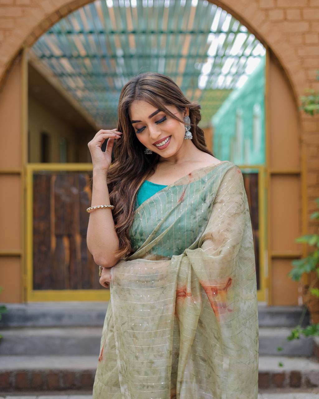 Mehendi-Green Pure Organza-Silk saree with all over Zari Sequins and Tassels paired with Blouse