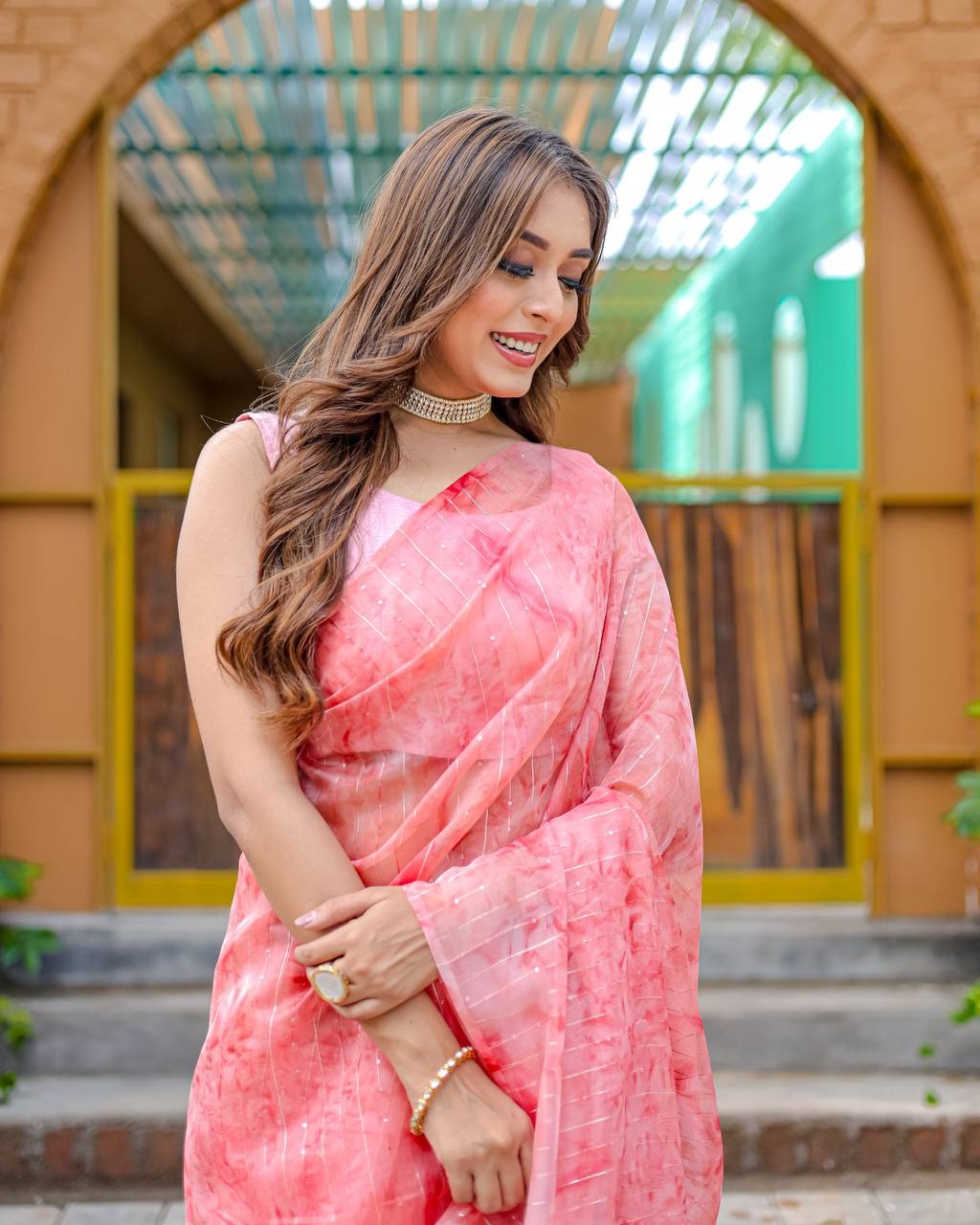 Light-Pink Pure Organza-Silk saree with all over Zari Sequins and Tassels paired with Blouse