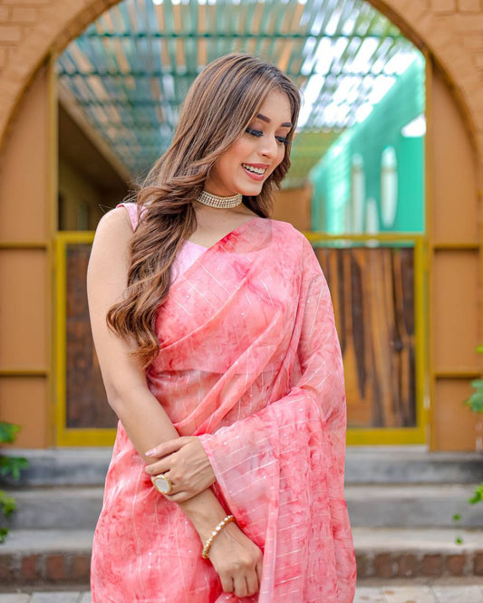 Light-Pink Pure Organza-Silk saree with all over Zari Sequins and Tassels paired with Blouse