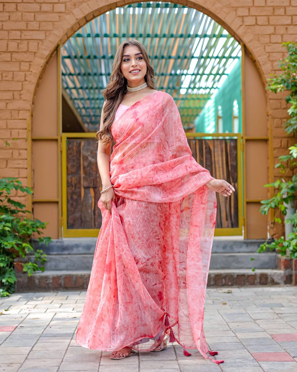 Light-Pink Pure Organza-Silk saree with all over Zari Sequins and Tassels paired with Blouse
