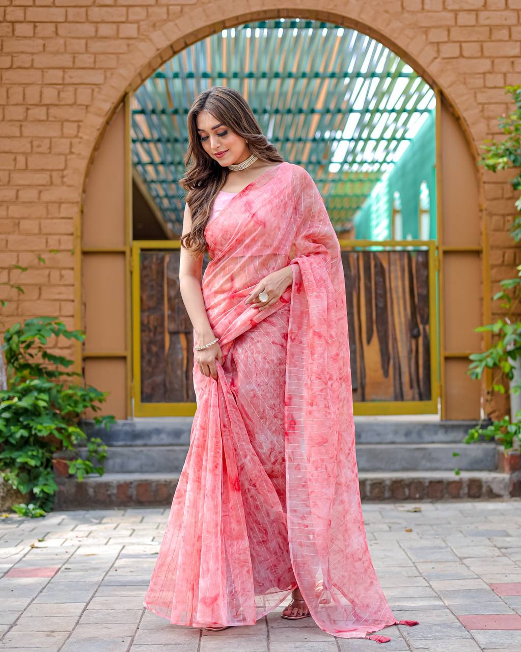Light-Pink Pure Organza-Silk saree with all over Zari Sequins and Tassels paired with Blouse