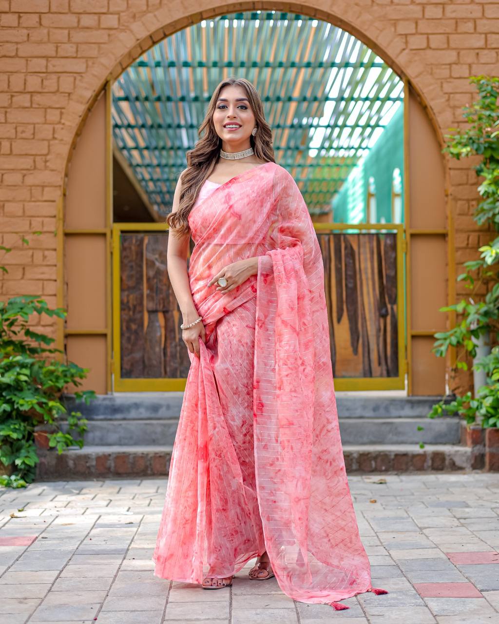 Light-Pink Pure Organza-Silk saree with all over Zari Sequins and Tassels paired with Blouse