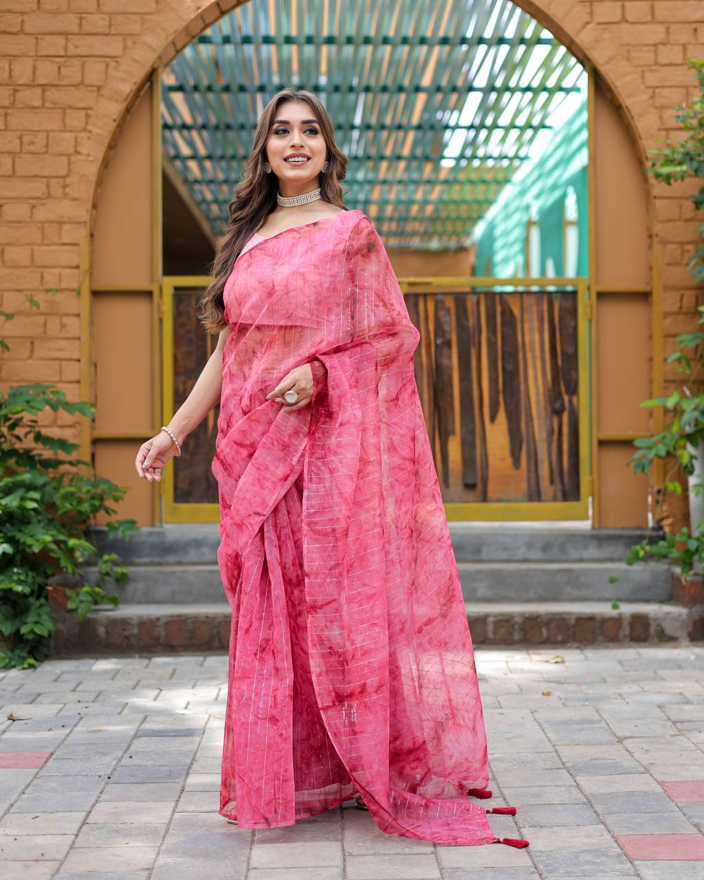 Bright-Pink Pure Organza-Silk saree with all over Zari Sequins and Tassels paired with Blouse