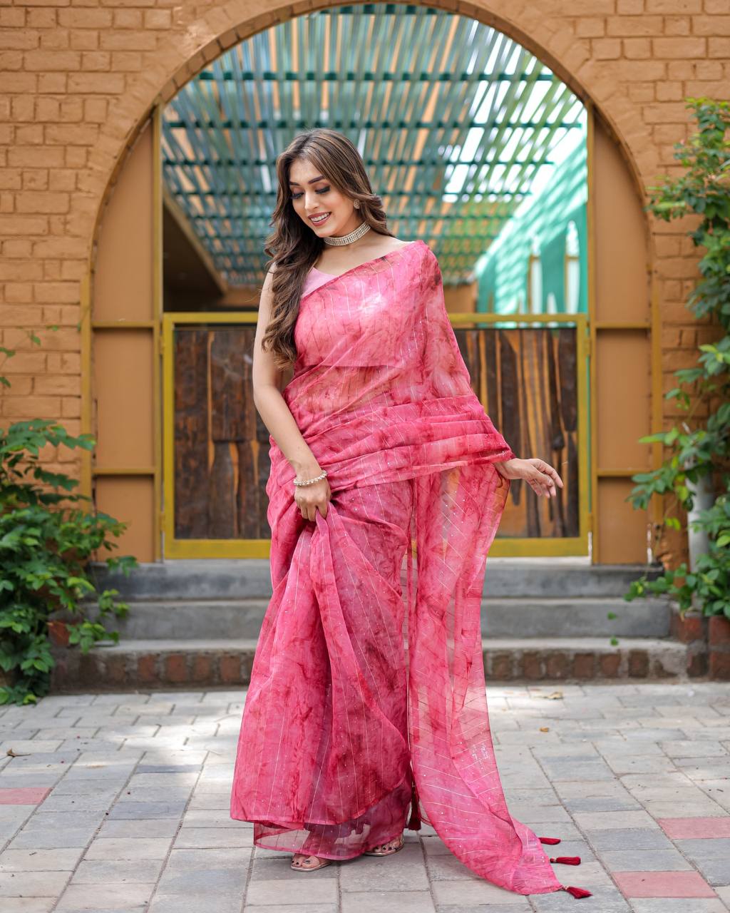 Bright-Pink Pure Organza-Silk saree with all over Zari Sequins and Tassels paired with Blouse