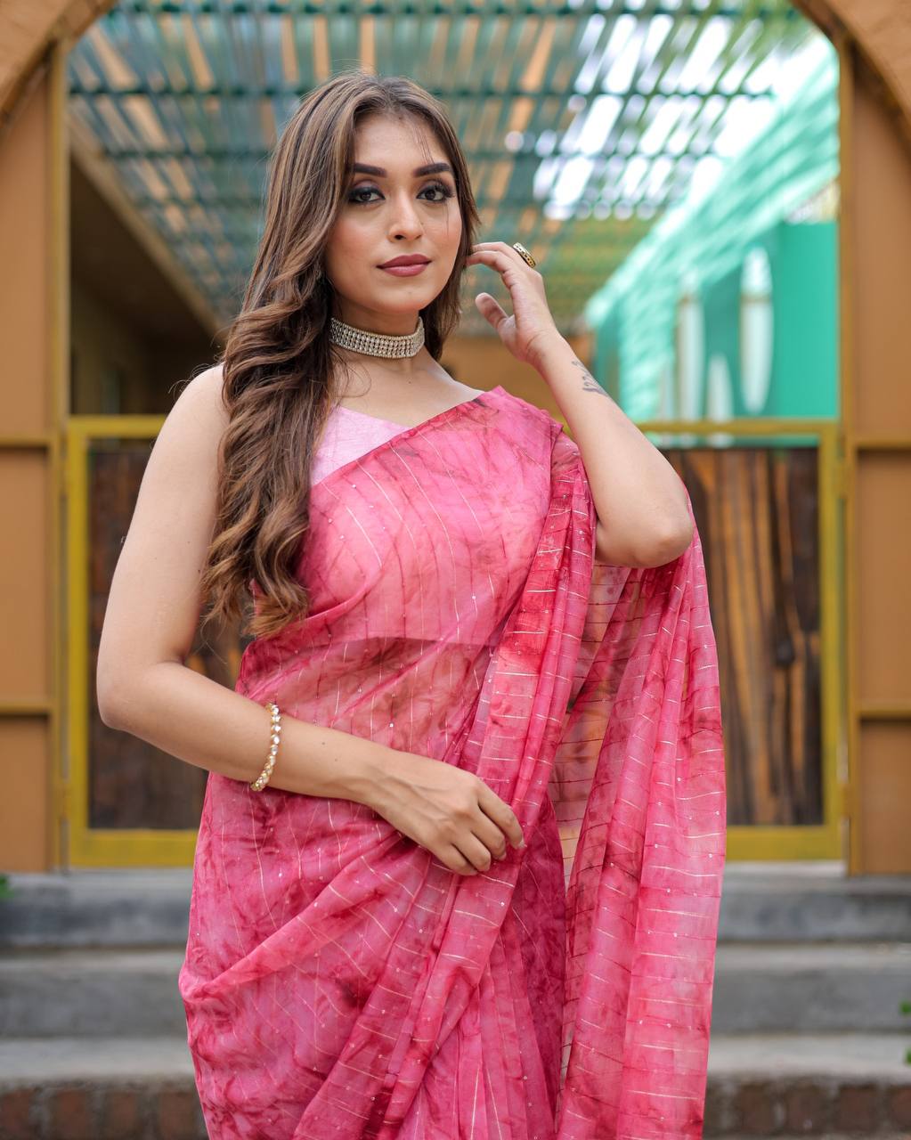 Bright-Pink Pure Organza-Silk saree with all over Zari Sequins and Tassels paired with Blouse