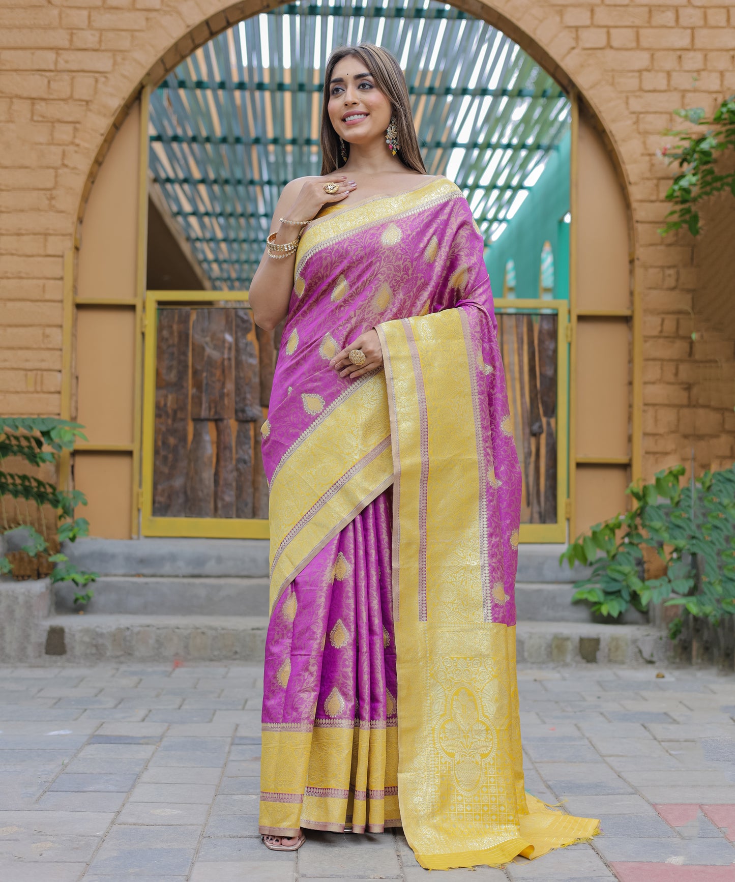 Heavy Embroidered Magenta saree with Sunny-Yellow Zari Border paired with Blouse