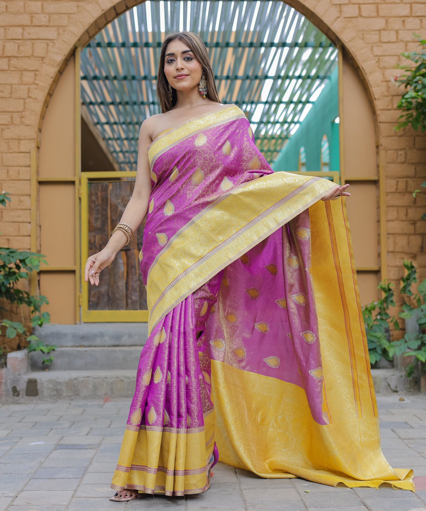 Heavy Embroidered Magenta saree with Sunny-Yellow Zari Border paired with Blouse
