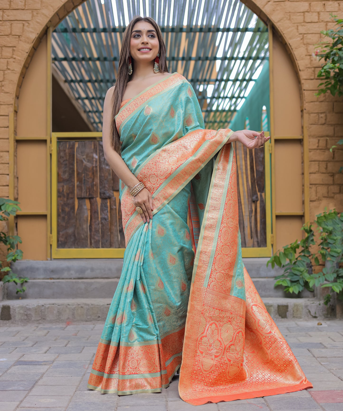 Heavy Embroidered Light-Blue saree with Soft-Orange Zari Border paired with Blouse