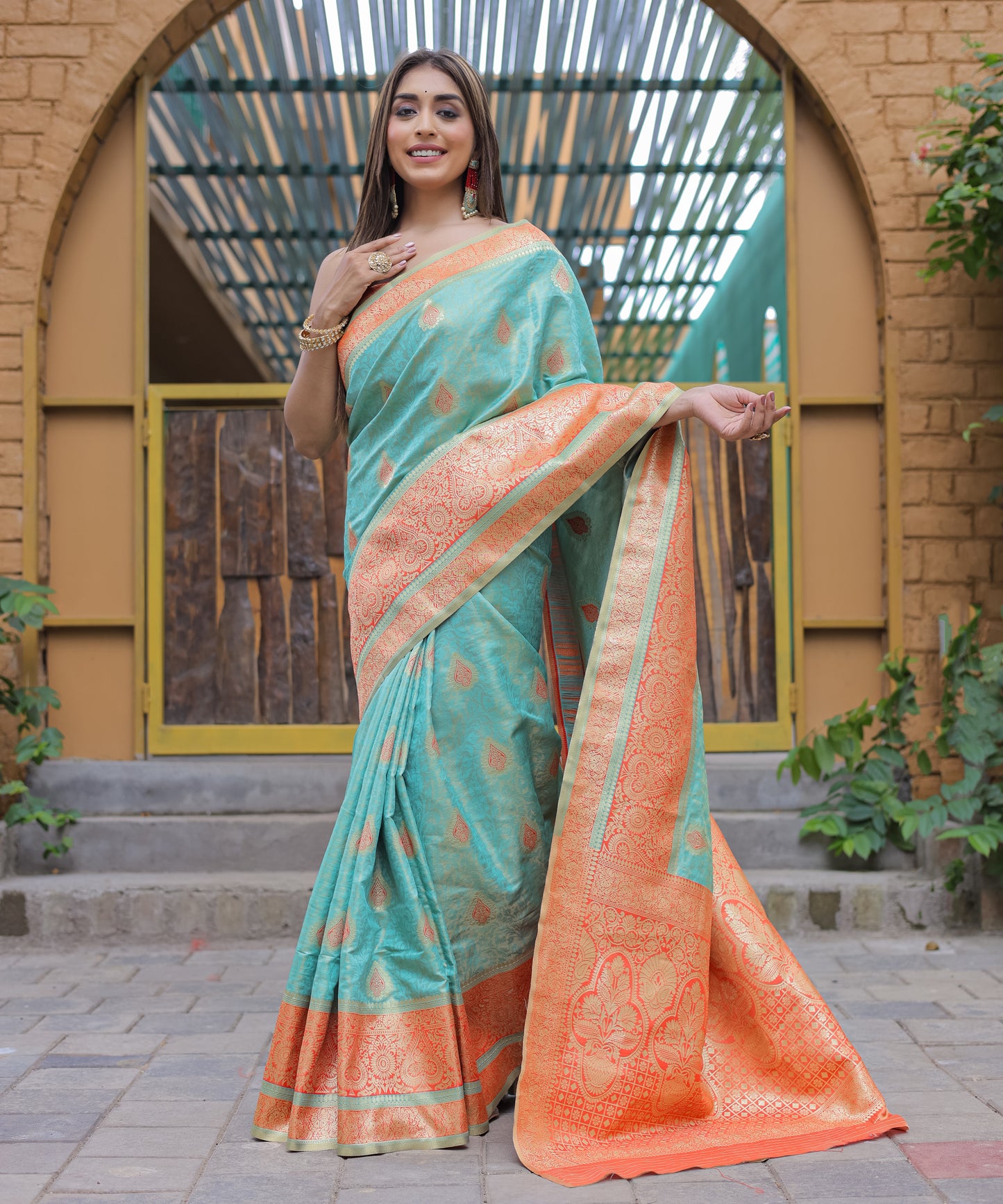 Heavy Embroidered Light-Blue saree with Soft-Orange Zari Border paired with Blouse