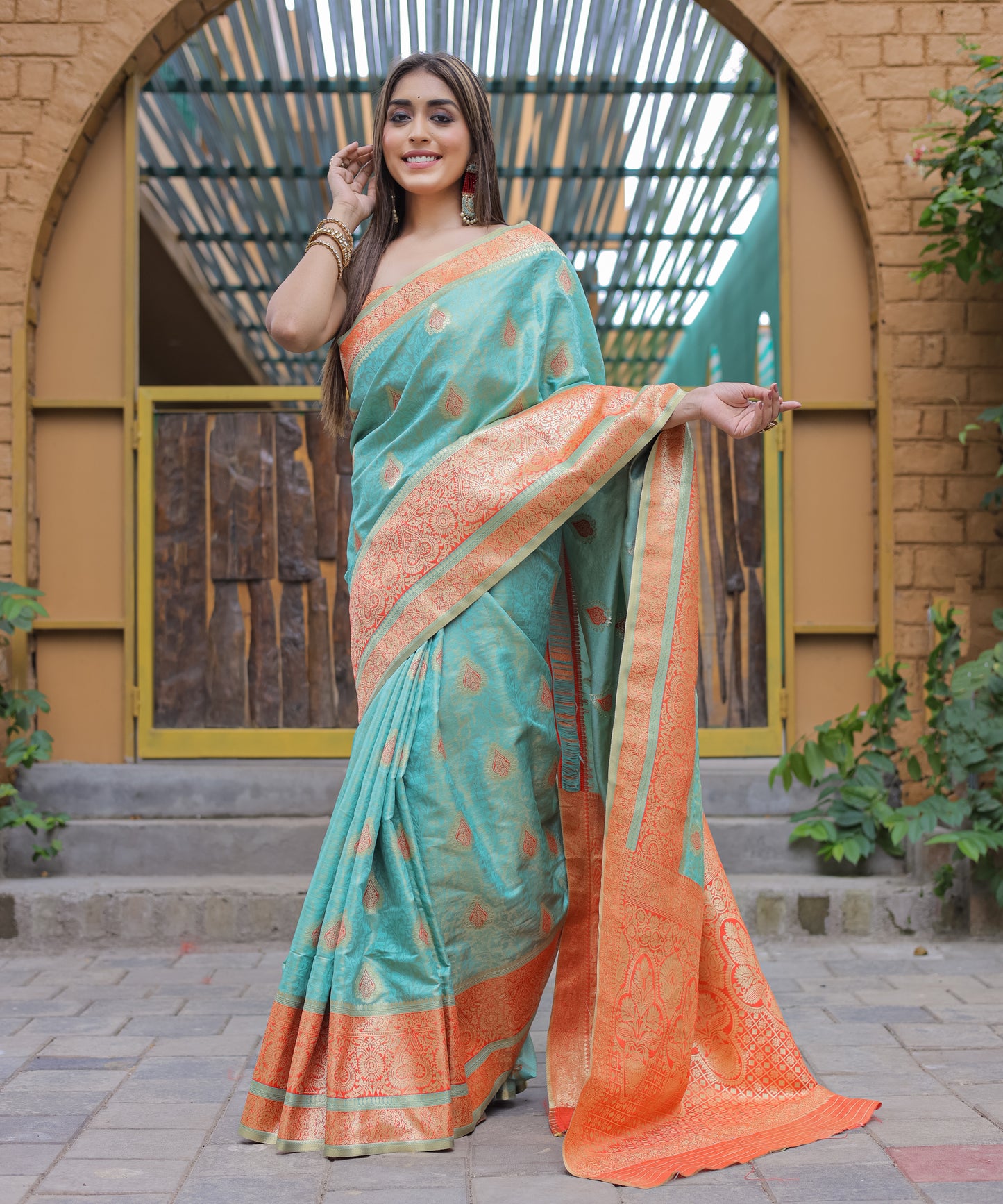 Heavy Embroidered Light-Blue saree with Soft-Orange Zari Border paired with Blouse