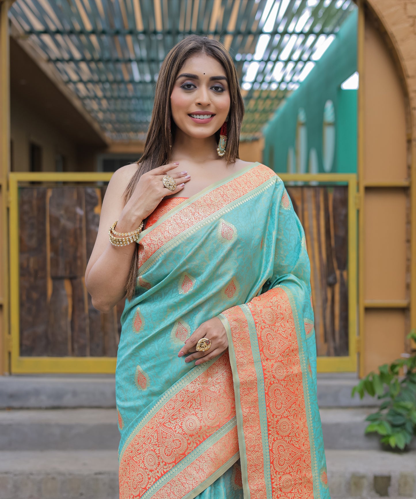 Heavy Embroidered Light-Blue saree with Soft-Orange Zari Border paired with Blouse