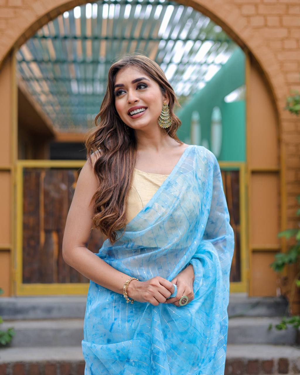 Sky-Blue Pure Organza-Silk saree with all over Zari Sequins and Tassels paired with Blouse