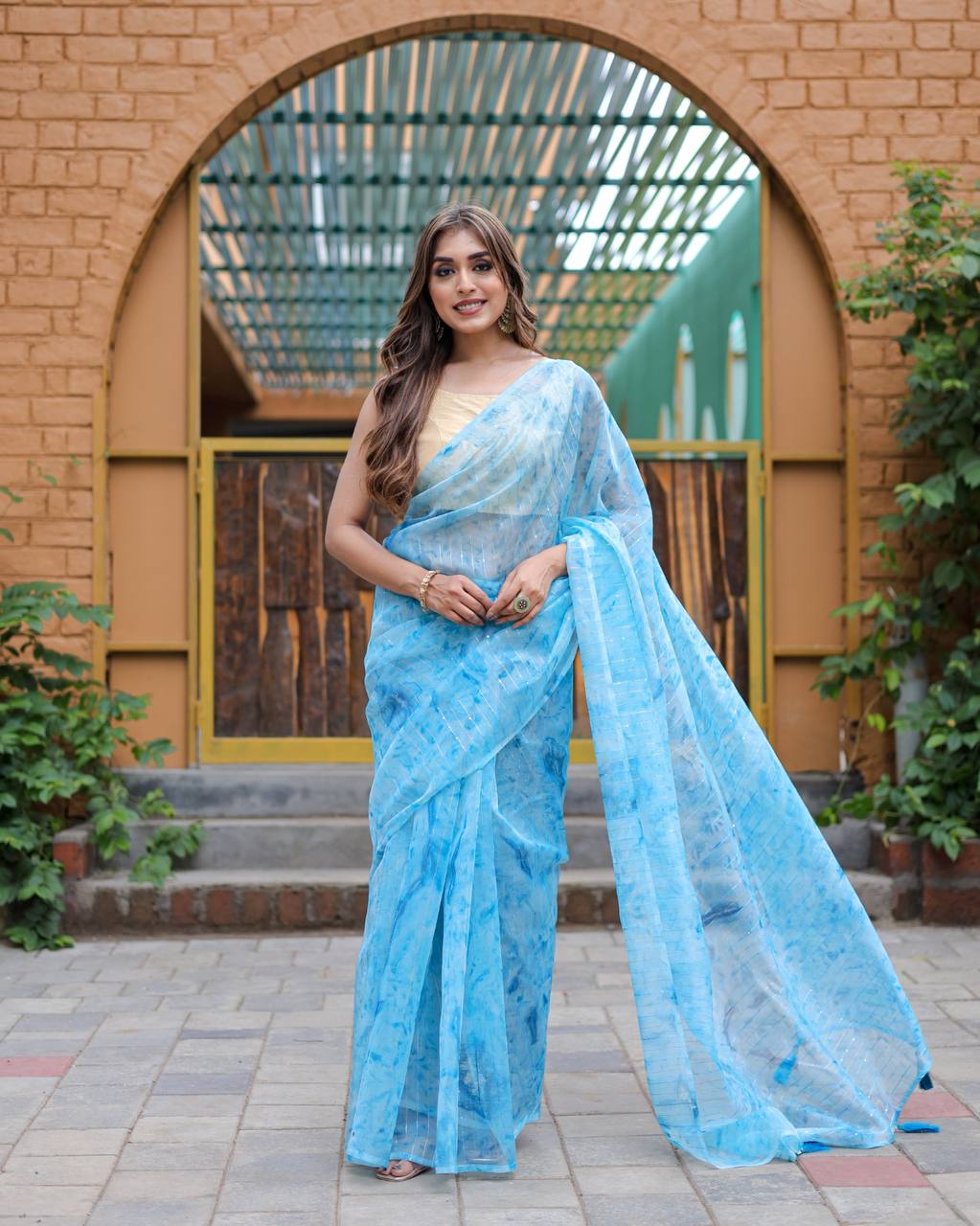 Sky-Blue Pure Organza-Silk saree with all over Zari Sequins and Tassels paired with Blouse