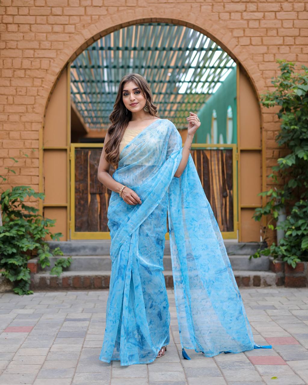 Sky-Blue Pure Organza-Silk saree with all over Zari Sequins and Tassels paired with Blouse