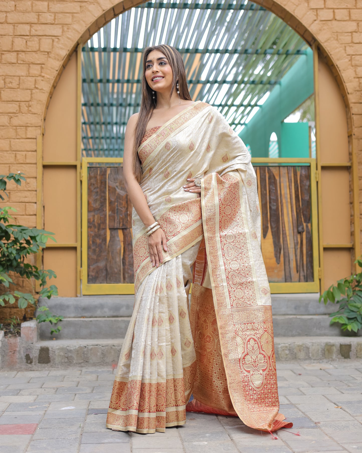 Heavy Embroidered Off-White saree with Red Zari Border paired with Blouse