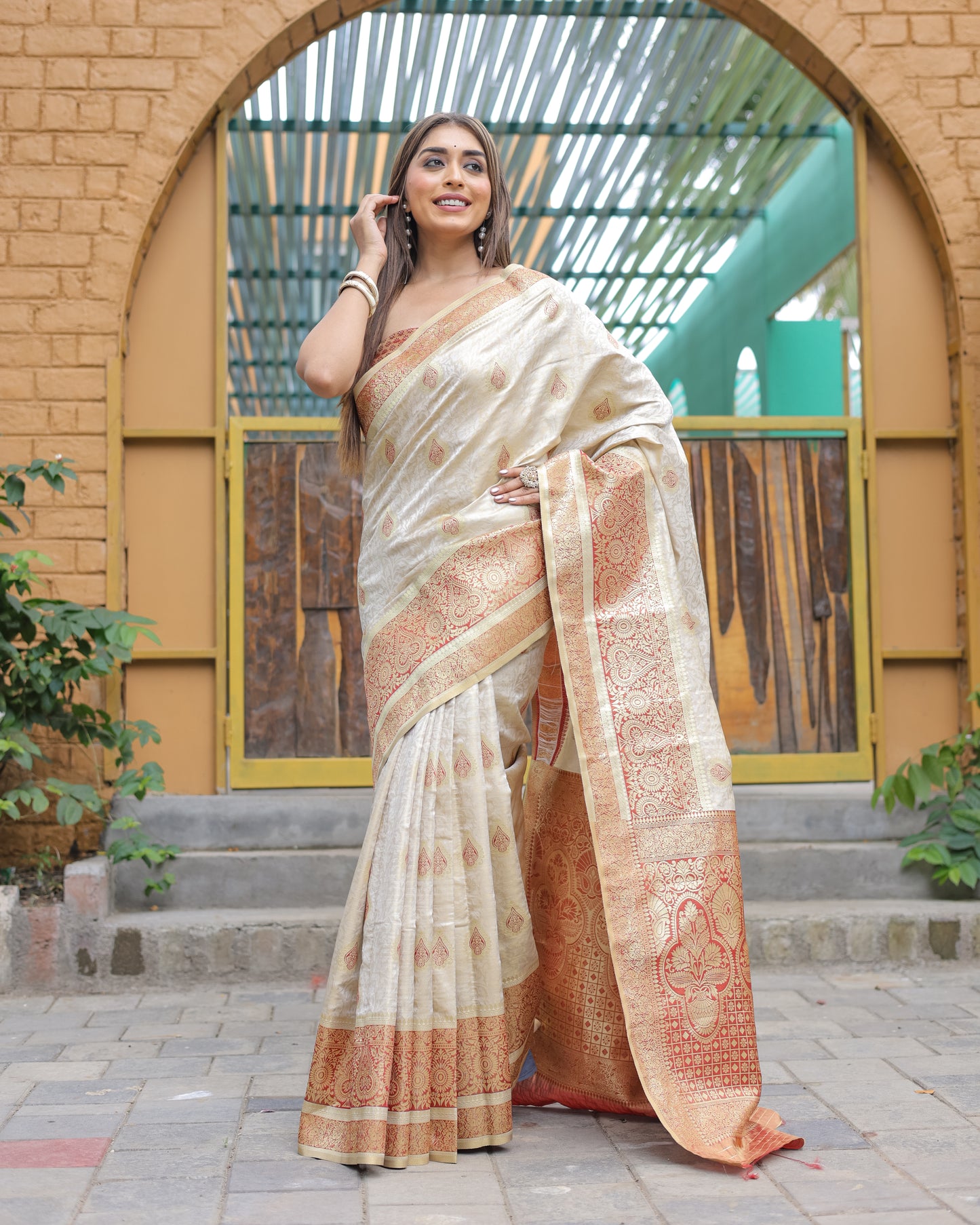Heavy Embroidered Off-White saree with Red Zari Border paired with Blouse