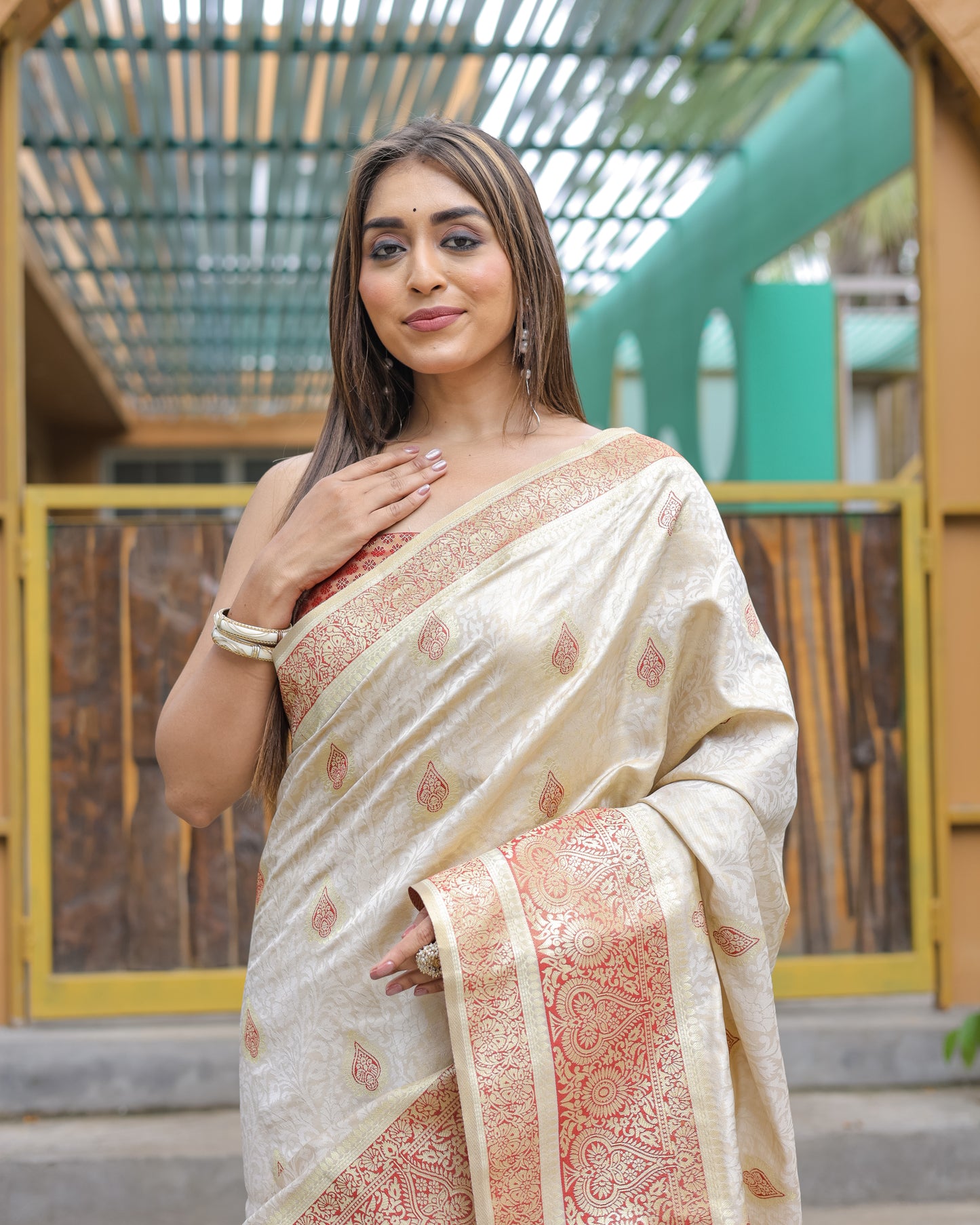 Heavy Embroidered Off-White saree with Red Zari Border paired with Blouse