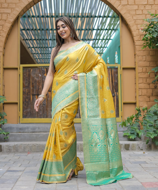 Heavy Embroidered Bright-Yellow saree with Sea-Green Zari Border paired with Blouse