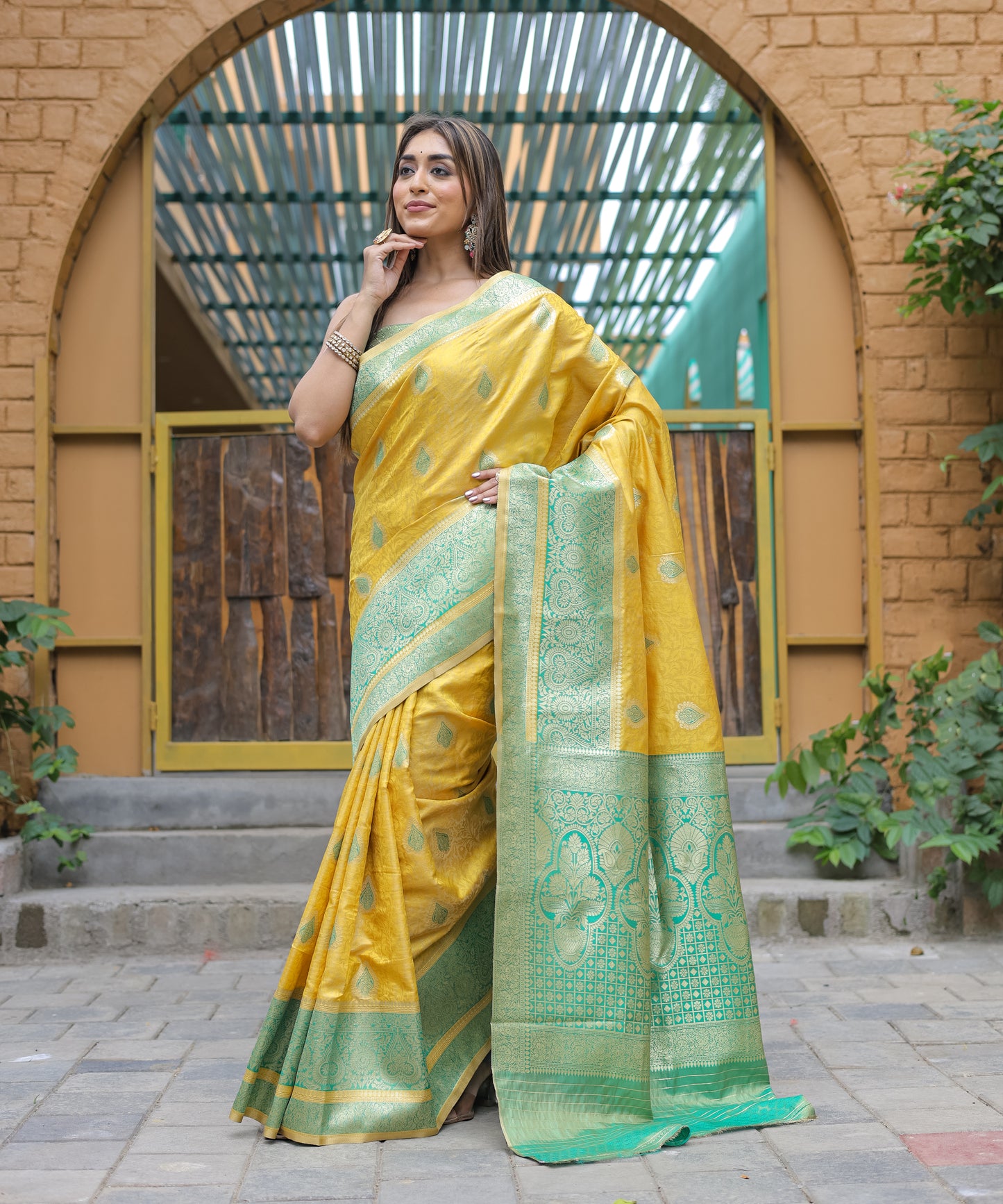 Heavy Embroidered Bright-Yellow saree with Sea-Green Zari Border paired with Blouse